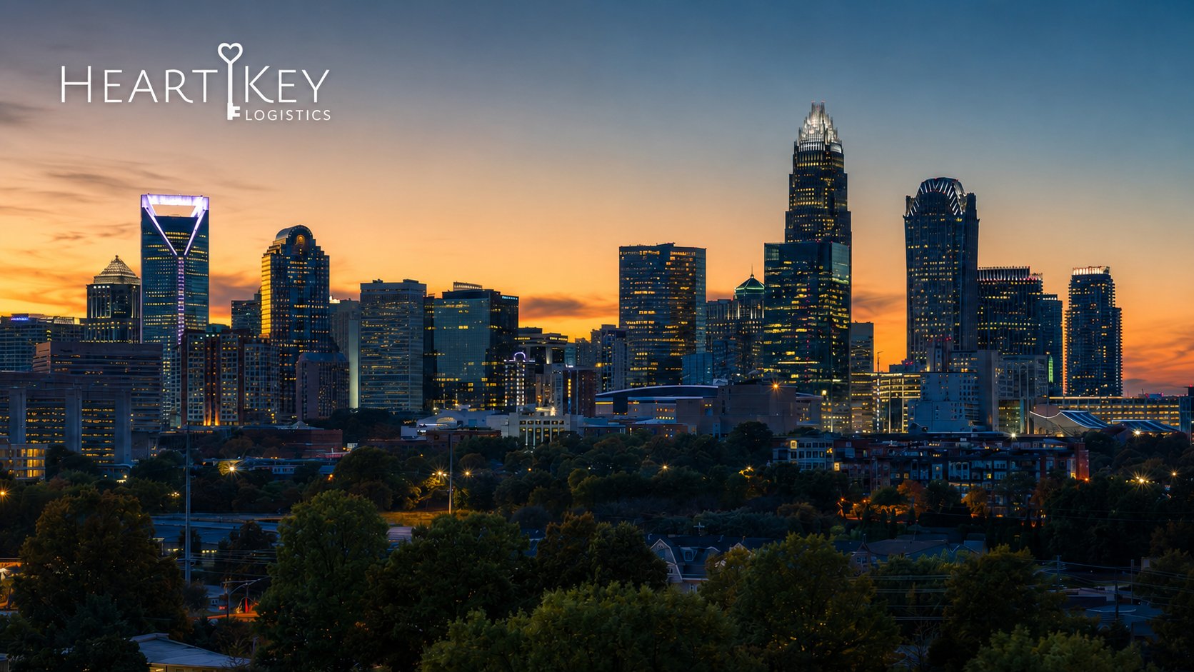Charlotte skyline at dusk with the Heart Key Logistics logo